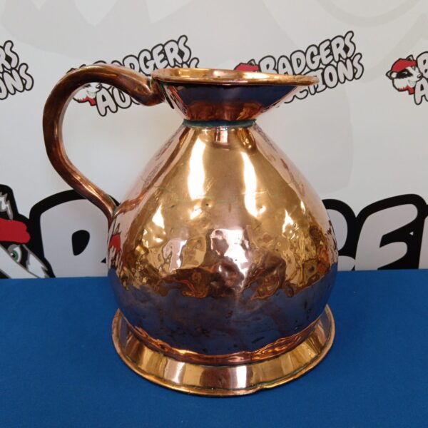 Antique Georgian copper haystack pitcher with a warm patina.