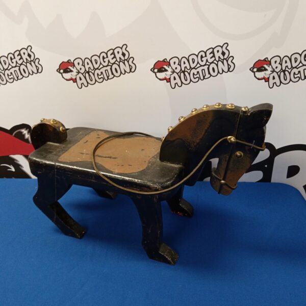 Vintage wooden rocking horse, antique toy for nursery decor.