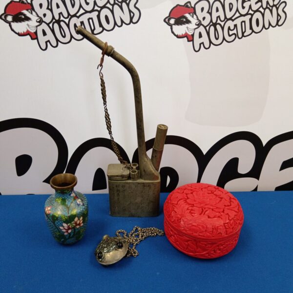 Oriental collectibles lot featuring antique pipe and vase.