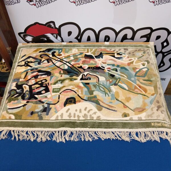 Vibrant Kandinsky style rug with abstract geometric design.