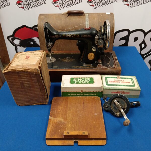 Vintage Singer sewing machine model 8094207 with motor and accessories.