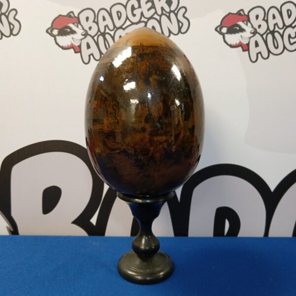 Signed Poldun decorative egg with detailed cityscape painting.