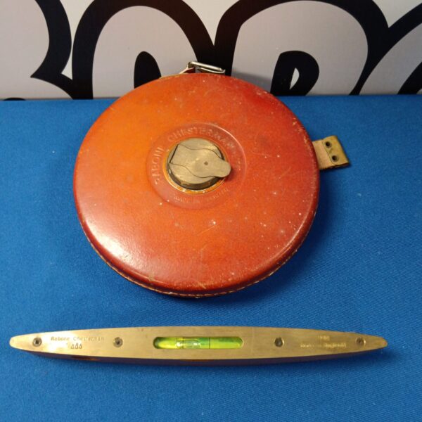 Vintage Rabone Chesterman tape measure with spirit level, antique measuring tool.