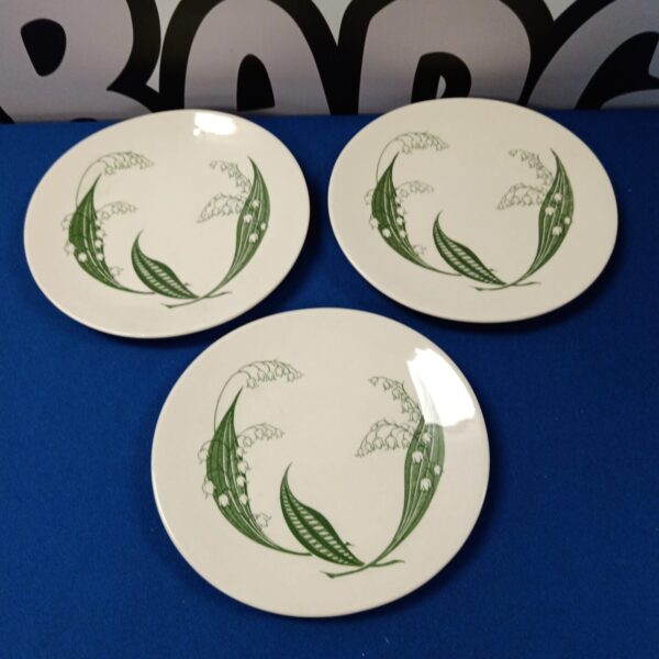 Vintage Clarice Cliff sandwich plates with floral design.