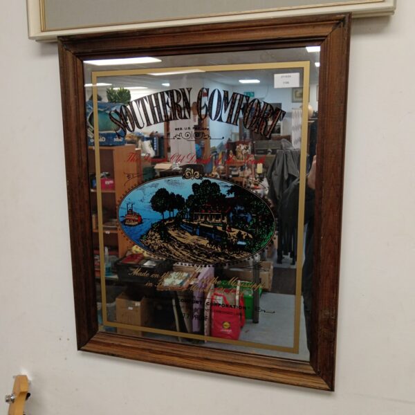 Vintage Southern Comfort pub mirror with rural scene.
