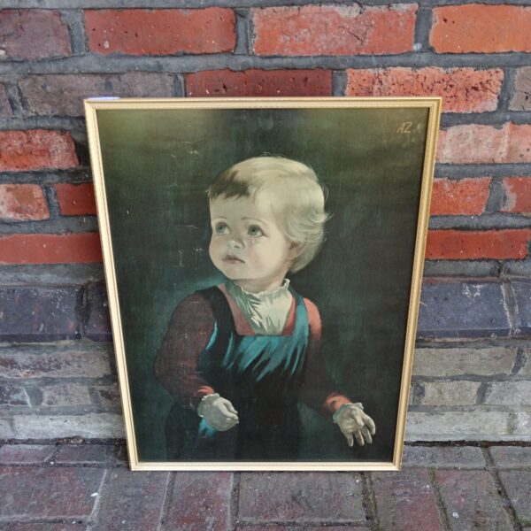 Vintage framed print of a crying child signed "az" for wall decor.