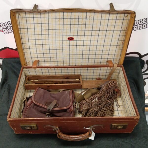Vintage leather gun cleaning case with accessories.