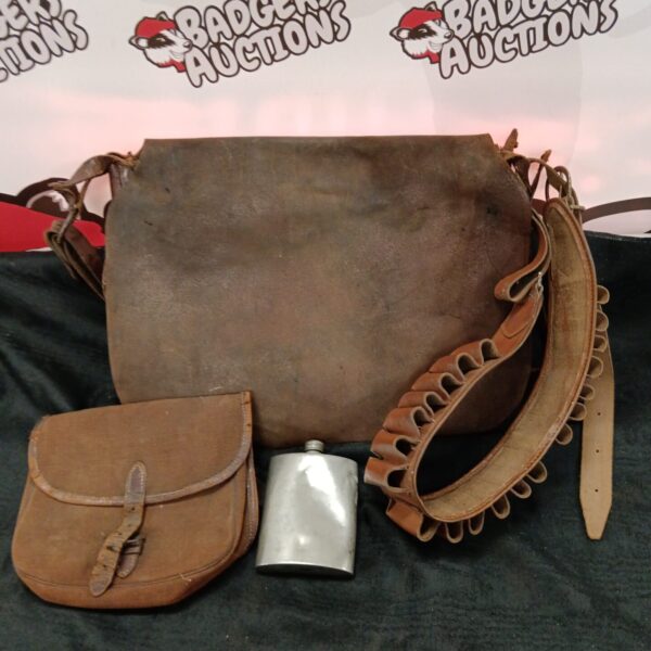 Vintage leather game bag with cartridge belt and hip flask.