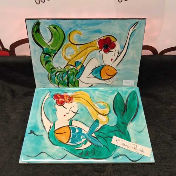 Vintage ceramic mermaid tile with colourful artwork.