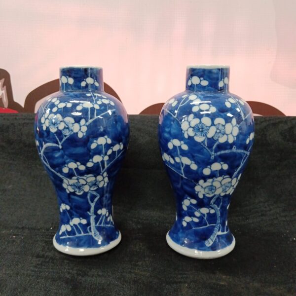 Antique Chinese porcelain vases, blue and white floral design.