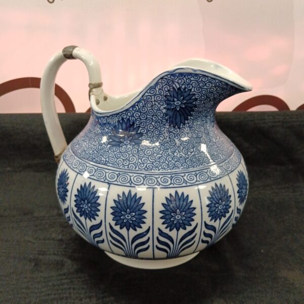 Large Victorian Minton blue and white jug with intricate detailing.