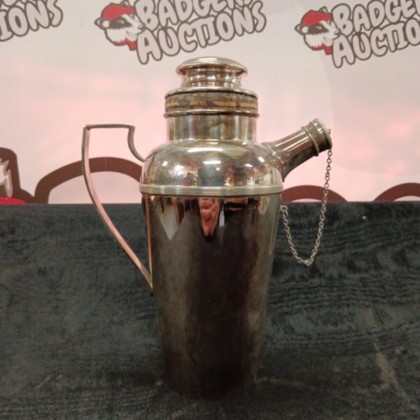 Vintage silver plate cocktail shaker with chain detail.
