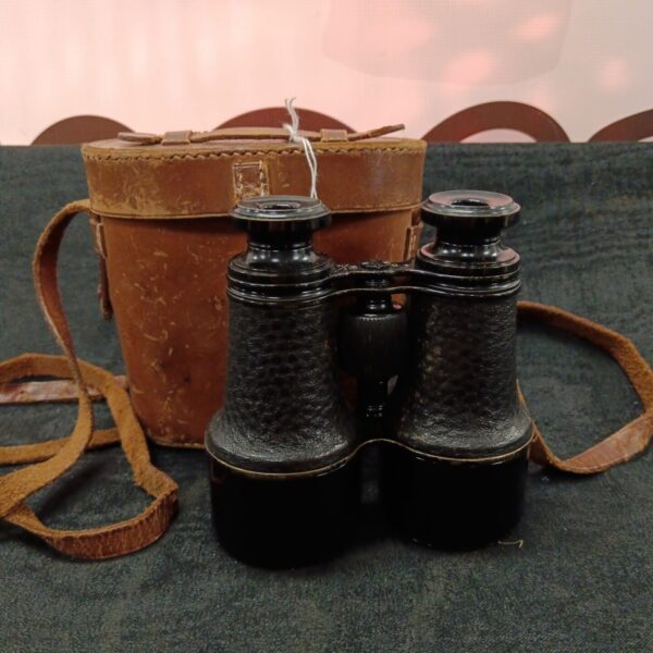 WWI era binoculars with a worn leather case.