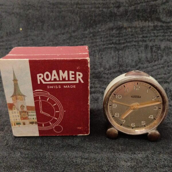 Vintage Roamer Swiss travel clock with box, collectible timepiece.