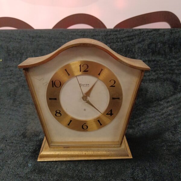 Vintage Swiza carriage clock with brass case and dial.