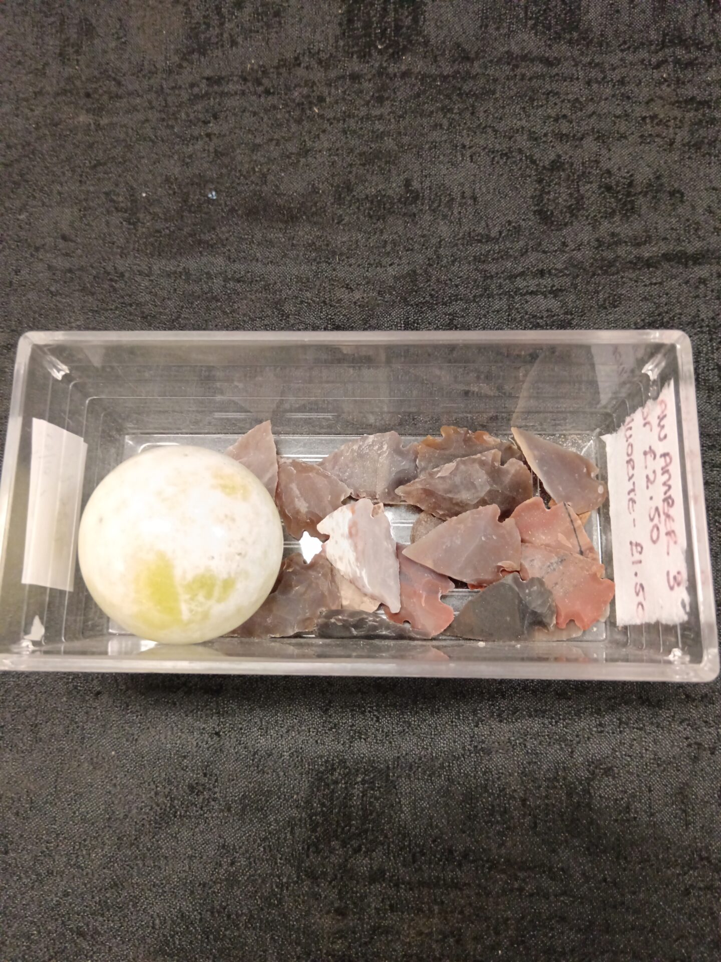 780 Tray of stone arrow heads & marble ball
