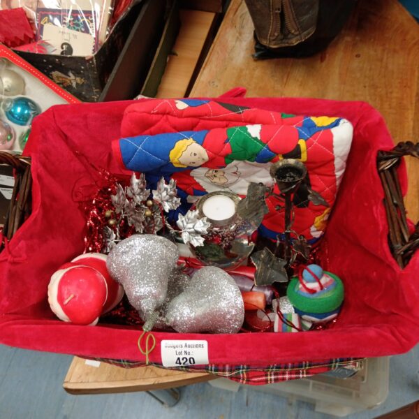 Vintage Christmas decorations in a red basket.