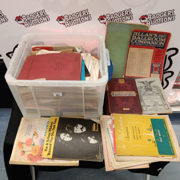 Large collection of vintage sheet music in a storage box.