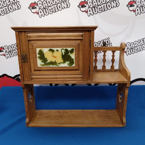Antique Victorian tile fronted display cabinet for collectibles.