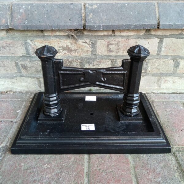 Ornate Victorian cast iron boot scraper for cleaning footwear.