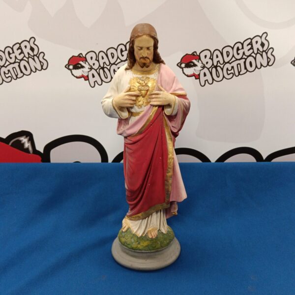 Vintage plaster statue of Jesus Christ for religious display.