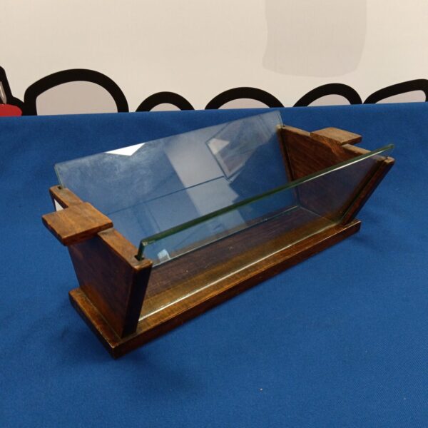 Vintage art deco book trough with glass panel display.