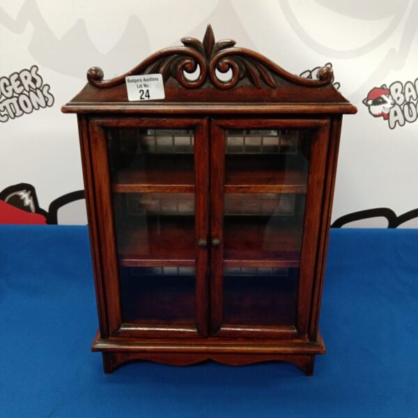 Small oriental display cabinet with glass front for collectibles.