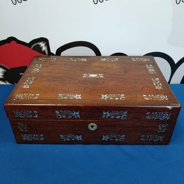 Vintage wooden box with delicate floral mother of pearl inlay.