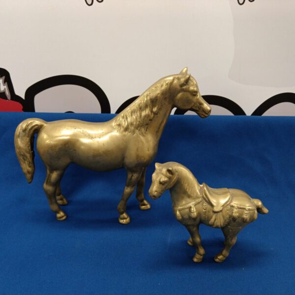 Pair of vintage brass horses, detailed antique figurines.