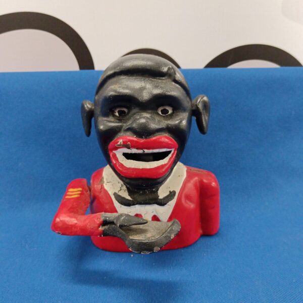 Antique cast iron black boy money box, vintage Americana collectible.
