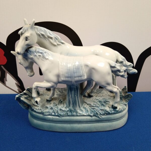 Vintage German porcelain horse figurine group, detailed and collectible.