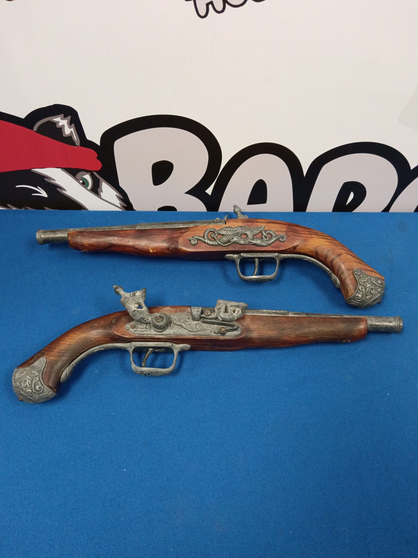 056 Two flint lock wall hanging pistols