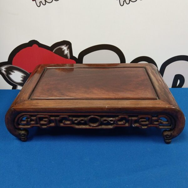 Antique Chinese pot stand with carved hardwood details.