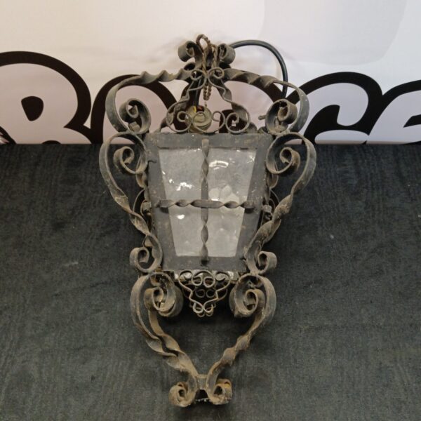 Vintage wrought iron ceiling lamp with gothic detailing.