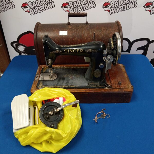 Vintage Singer sewing machine, model 8356799, treadle base.