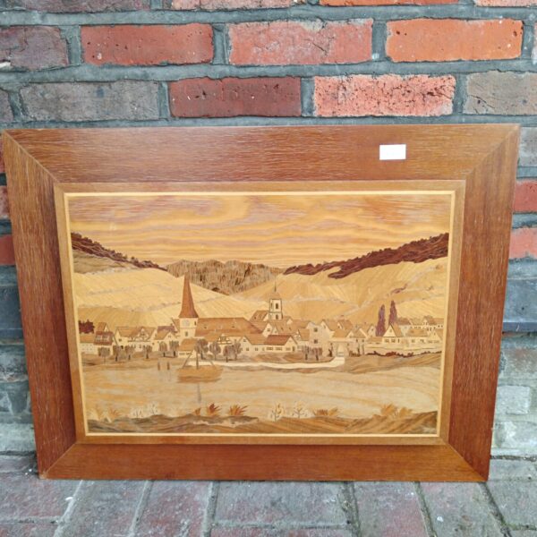 Antique marquetry panel depicting a charming lakeside village scene.