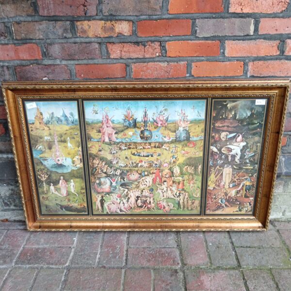 Large framed print of Hieronymus Bosch’s Garden of Earthly Delights triptych.