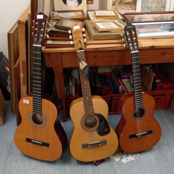 Vintage acoustic guitar lot including Encore and Valencia models.