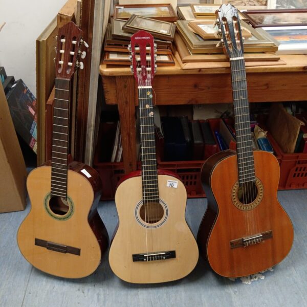 Lot of three vintage acoustic guitars for sale.