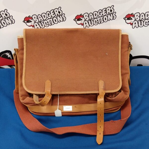 Vintage canvas and leather shooting bag for outdoor use.