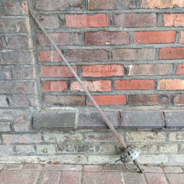 Vintage Toledo ceremonial sword with ornate hilt and rapier blade.