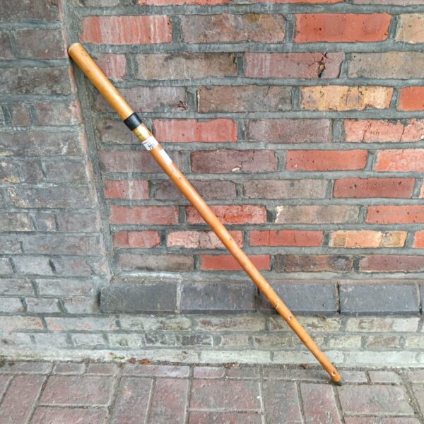 Antique walking cane with hidden flask compartment, vintage collectible.