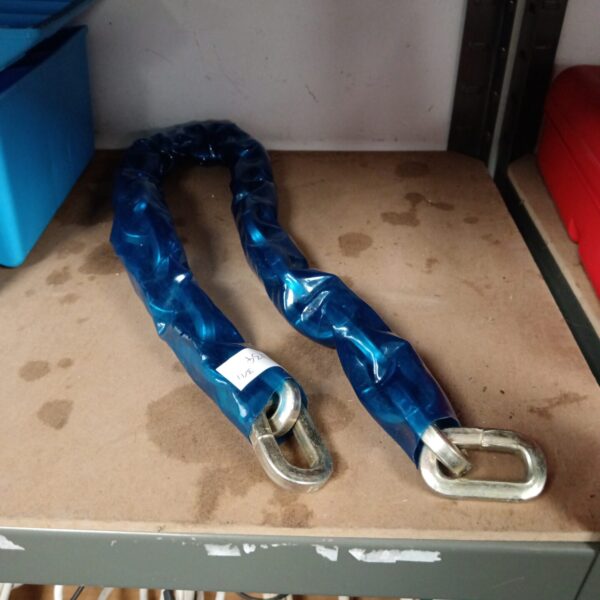 Blue bike security chain with metal loops for locking bicycles.