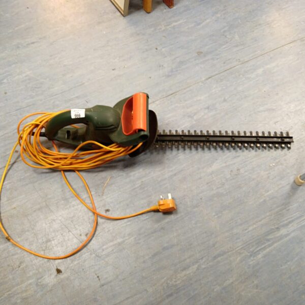 Black & Decker electric hedge cutter for garden trimming.