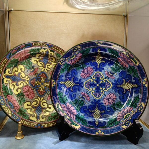 Antique Royal Doulton plates with Islamic pattern and blue background.