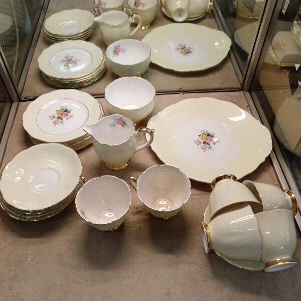 Vintage Queen Anne bone china teaset with floral design.