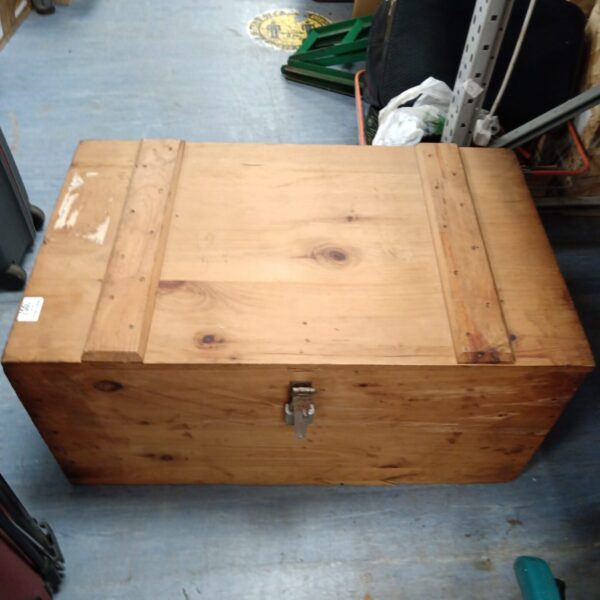 Large vintage pine trunk for storage and rustic decor.