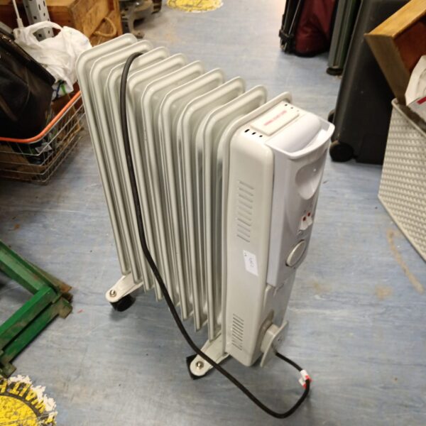 White oil filled radiator with castors for portable heating.