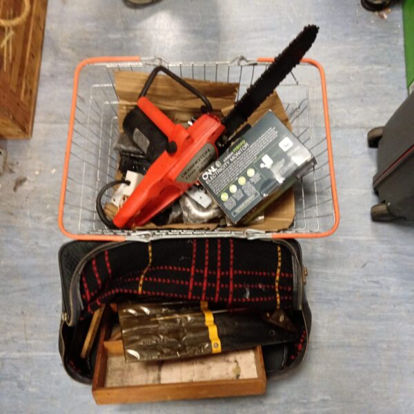 Remington electric chainsaw in a basket of tools.