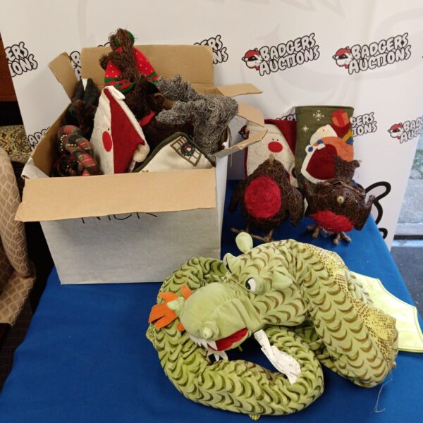 Christmas decorations lot featuring a green dragon draft excluder.